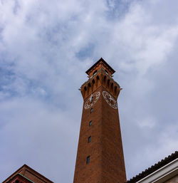 Low angle view of clock tower against sky