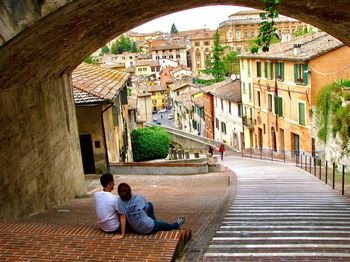 People sitting in front of building