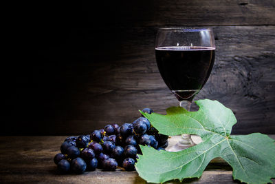 Grapes in glass on table