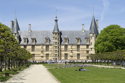 View of church and buildings against sky