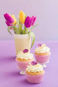 Close-up of pink roses on table