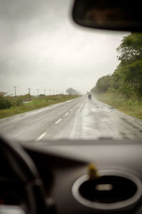 Road passing through forest