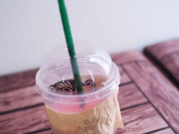 Close-up of drink in glass jar on table