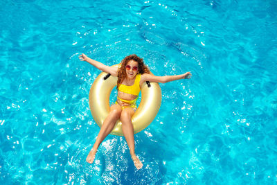 High angle view of woman swimming in pool