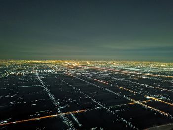 High angle view of illuminated cityscape at night