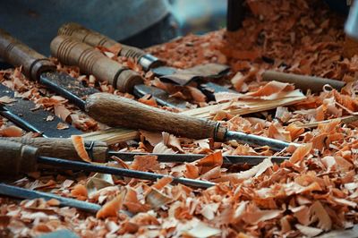 High angle view of wood shavings and tools