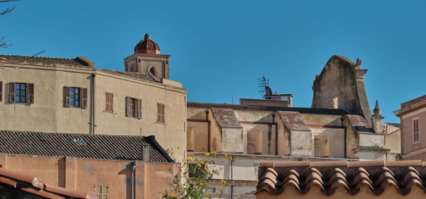 Low angle view of historic building against clear blue sky