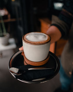 Close-up of coffee cup on table