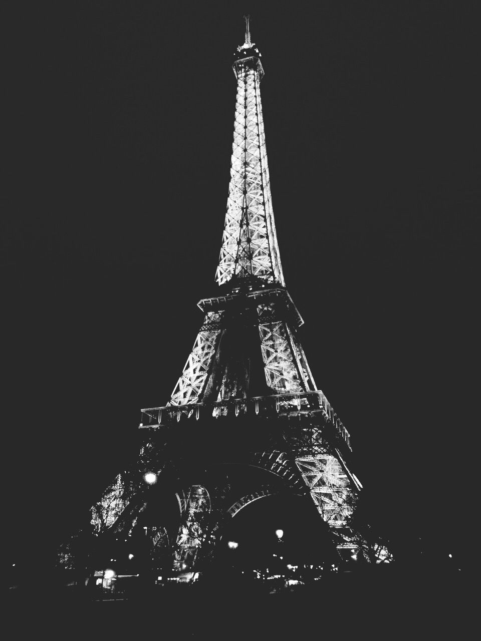 eiffel tower, low angle view, tall - high, tower, international landmark, famous place, travel destinations, architecture, built structure, tourism, capital cities, night, travel, clear sky, illuminated, culture, metal, city, sky, building exterior