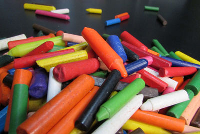 High angle view of multi colored candies in container