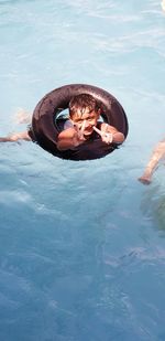 Portrait of boy swimming in pool