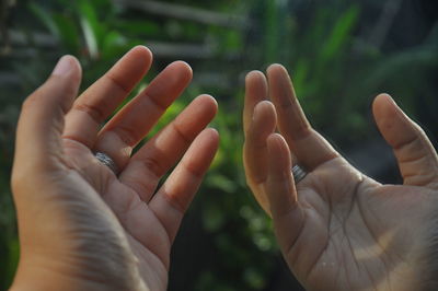 Close-up of hands against blurred background