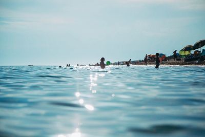 People swimming in sea