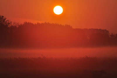 Scenic view of silhouette landscape against sky during sunset