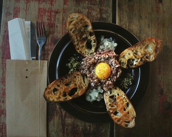 Close-up of foie gras and steak tartare in plate