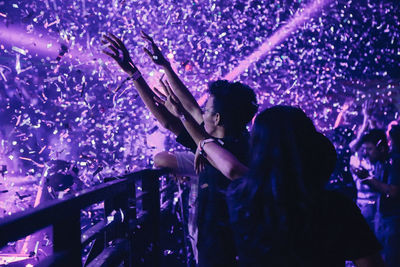 People enjoying music concert at night