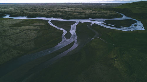 High angle view of water flowing through rocks