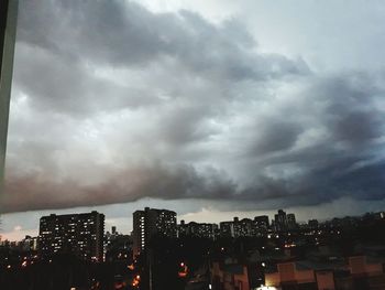 View of city against cloudy sky