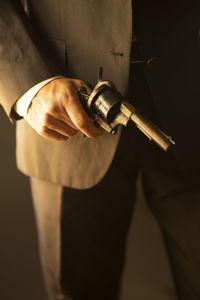 Midsection of man holding key