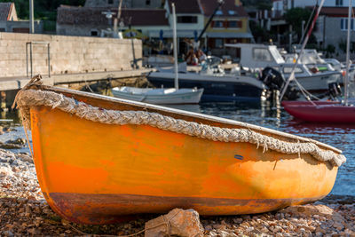 Close-up of fishing boats moored at harbor