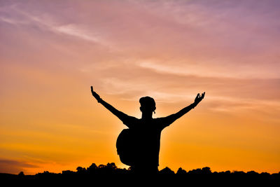 Silhouette of man at sunset