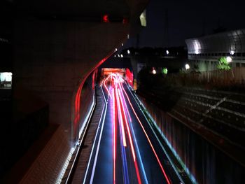 Light trails on railroad tracks at night