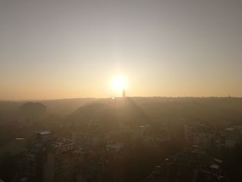 High angle view of buildings against sky during sunset