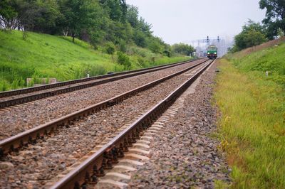 Train on railroad tracks against sky