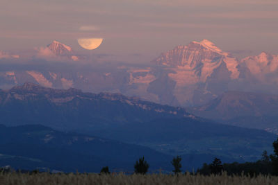 Scenic view of mountains against sky during sunset