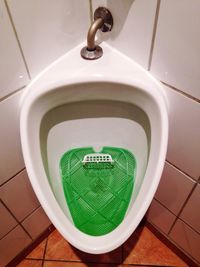 High angle view of urinal in public building