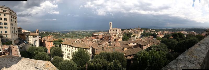 Panoramic view of town against sky