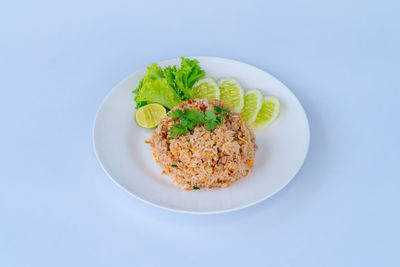 Directly above shot of food in plate on blue background