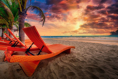 Scenic view of beach against sky during sunset