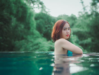 Portrait of woman swimming in pool