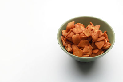 High angle view of breakfast on table against white background