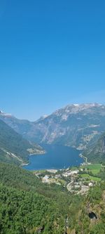Scenic view of mountains against clear blue sky