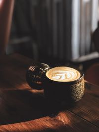 Close-up of coffee cup on table