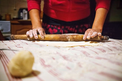 Midsection of woman preparing food