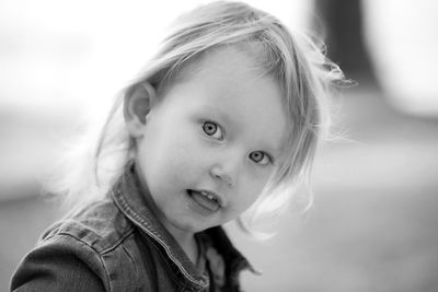 Black and white photo of girl at park