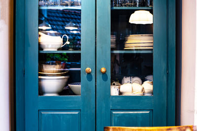 Close-of crockery kept in shelf