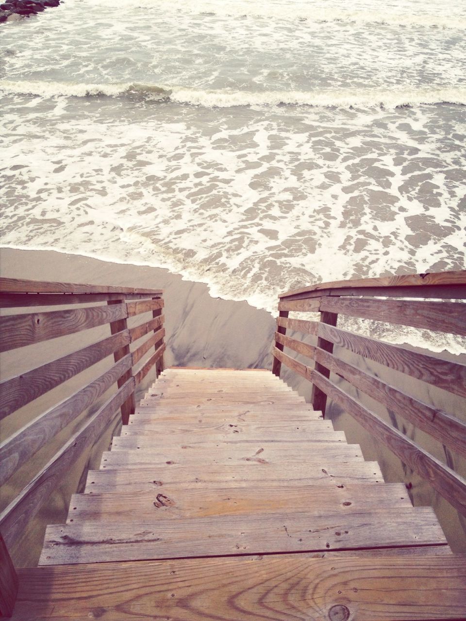 steps, the way forward, wood - material, boardwalk, high angle view, water, railing, steps and staircases, pier, staircase, sea, built structure, empty, wooden, wood paneling, absence, wood, day, stairs, beach