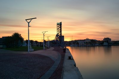 Scenic view of river against sky during sunset
