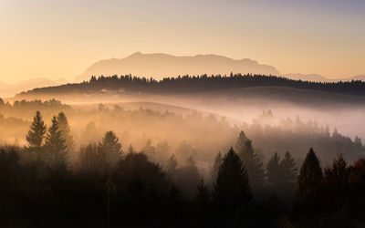 Scenic view of silhouette mountains against sky during sunset