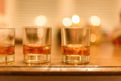 Close-up of beer glass on table