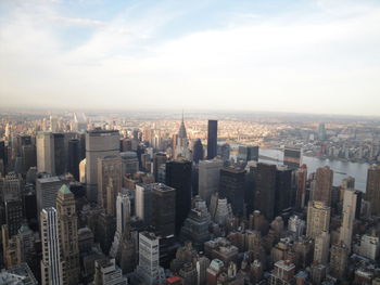 Aerial view of modern buildings in city against sky