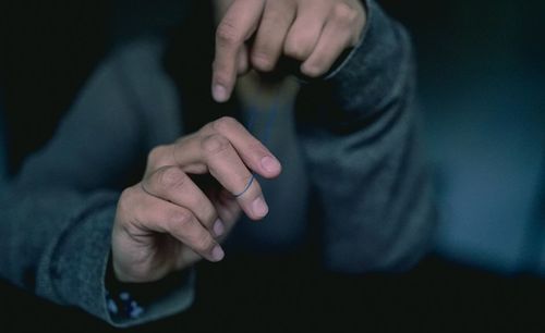 Close-up of man holding hands