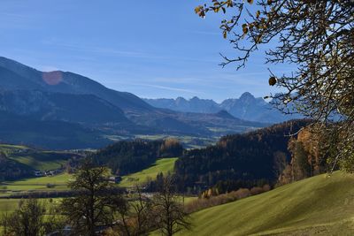 Scenic view of landscape and mountains against sky