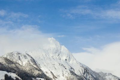 Scenic view of snow covered mountains