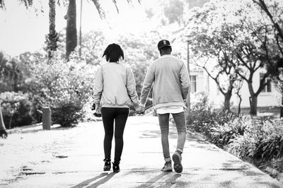 Rear view of couple walking outdoors