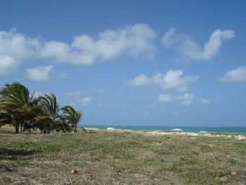 Scenic view of sea against cloudy sky